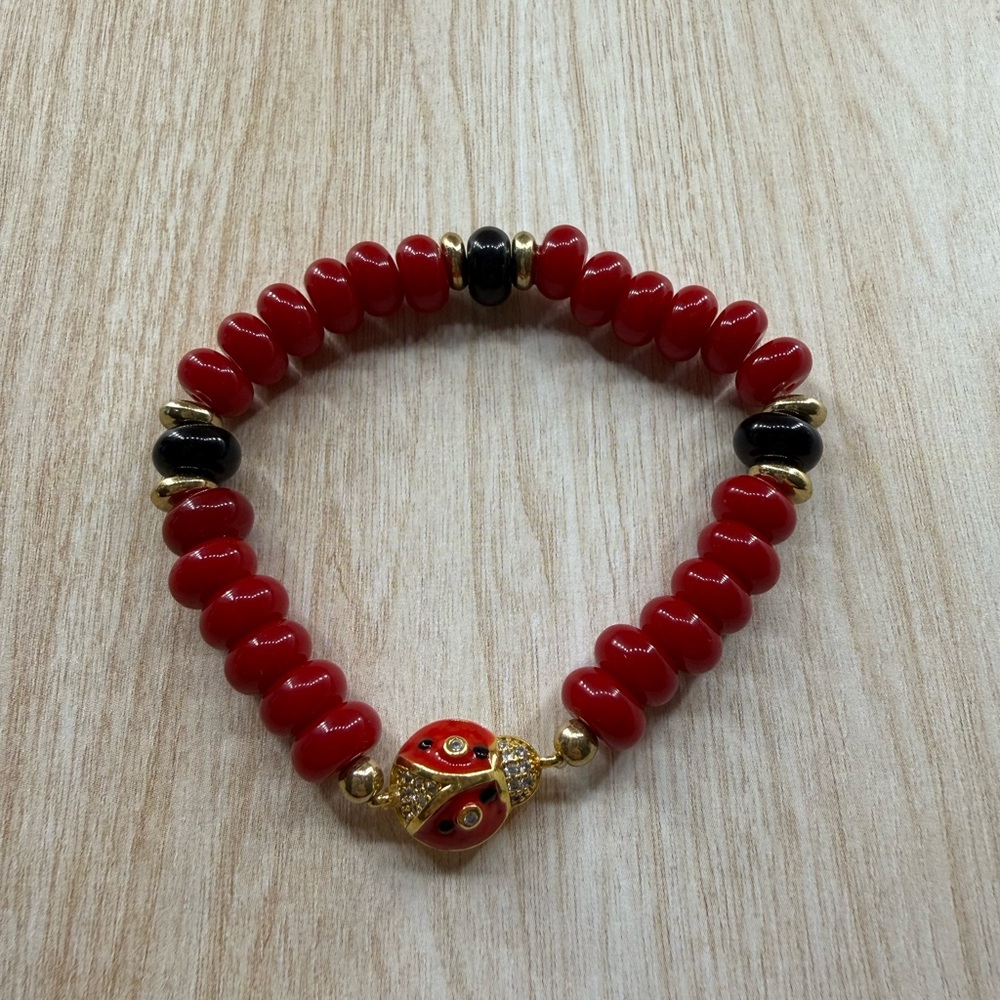 Red and Black Beaded Bracelet with Ladybug Charm